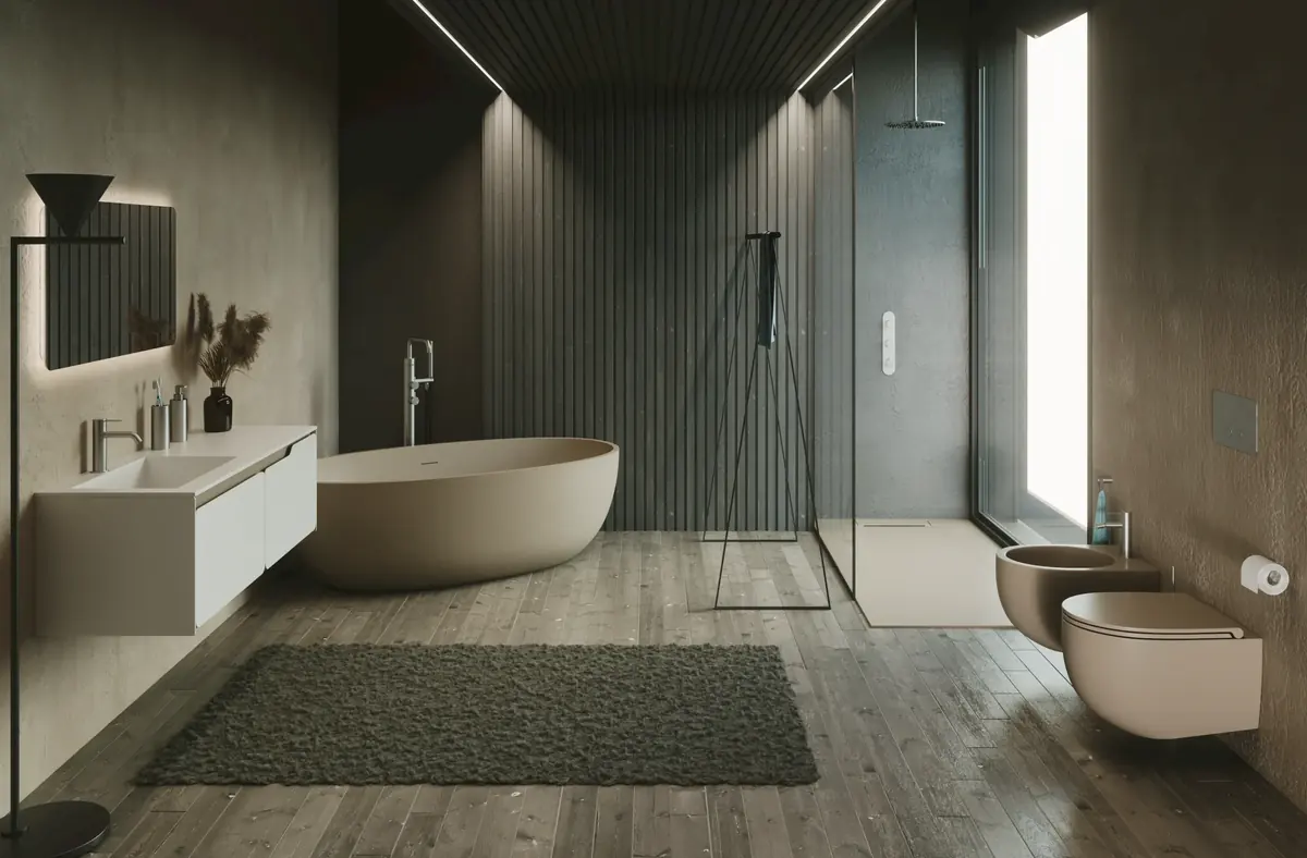 Baño con bañera exenta y sanitarios SDR Ceramiche en color arena sobre suelo de madera